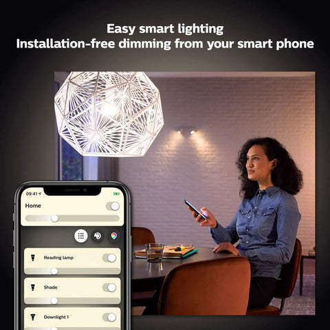 Woman using smartphone to control Smart Candle LED Bulb 40W Equivalent B39, 2 Pack, Soft Warm White, at home