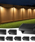 Solar Fence Lights Outdoor Waterproof LED Color Changing And Warm White Dope Color Options With 4 Modes For Backyard Patio Deck Railing Stair Handrail Pool And Wall 8 Pack illuminating a wooden fence at night with warm light.