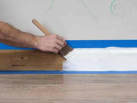Applying 1-2-3 Plus Water Based Primer Stain Blocking For Interior And Exterior Surfaces White 1 Quart to wood trim with brush