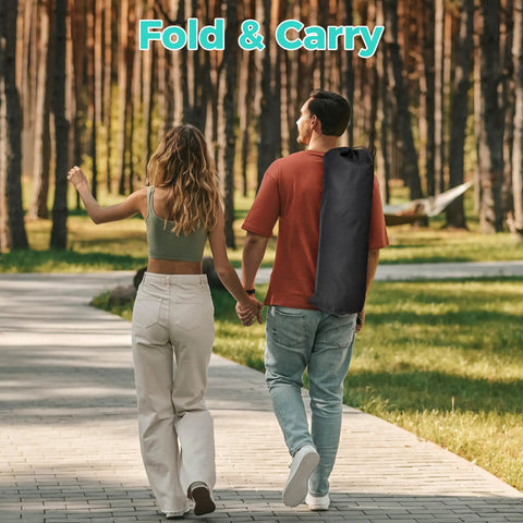 Man carries folded Hammock Camping Chair With Detachable Footrest And Cup Holder in bag, walking in forested park area
