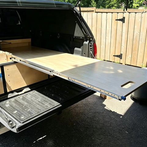 Heavy-Duty 56-Inch Full-Extension Drawer Slides Rock Solid Cold Rolled Steel Ball Bearing Rails mounted in a vehicle for storage.