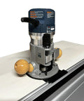 Pro Grade Router Guide Rail Adapter Fits Bosch 1617 Fixed Base Models With Dead On Centerline Alignment Tough As Nails Polymer Body Made In Usa For Quick Setup Job Site And Shop Woodworking Builds, mounted on a router with wooden handles.