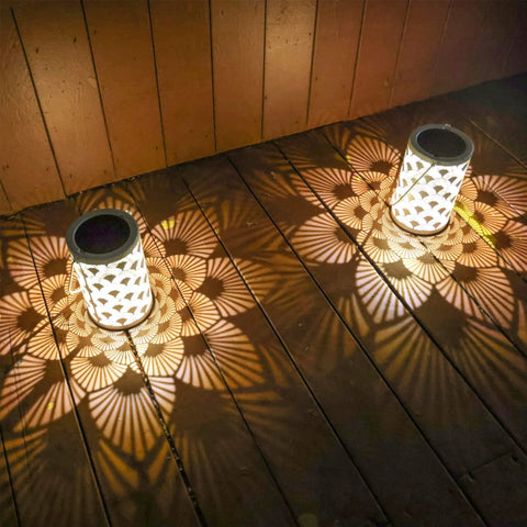 Solar Powered Outdoor Lanterns Waterproof White Table Lanterns Set Of 2 For Outdoor Use Hanging LED Lights illuminating wooden deck
