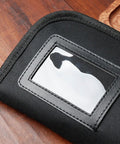 Close-up of a black knife bag with a zippered pouch, part of the Roll Up Knife Bag Case With Zippered Pouch For Secure Knife Transport.