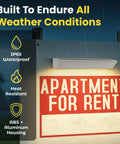 Solar Address Sign Light Two Pack With IP65 Waterproof above 'Apartment For Rent' sign in rain, built to endure weather.