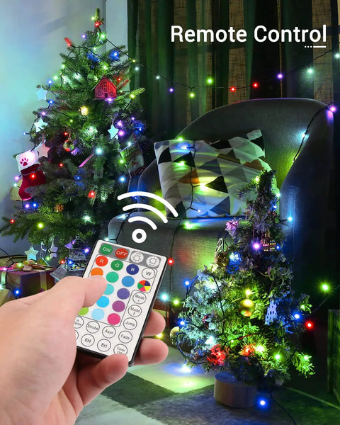 Hand using remote for Epic 270 Ft 800 LED Color Changing Christmas Lights With Remote Memory Function And 4H 6H 8H Timer