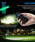 Hand holding X2 Rechargeable EDC Flashlight 2500 Lumen Portable Pocket Light shining bright outdoors, highlighting grass area.