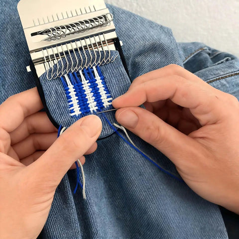 Hands using Complete Darning Kit With 14 Hook Mini Loom For Beginners Mushroom Patch Maker For Jeans And Socks Patch Repair Kit Includes Threads Needles Pin Cushion Crochet Hook Elastic Bands And Random Pattern Darning Accessories on blue fabric.