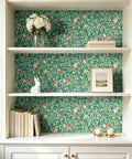 Hassle Free Peel And Stick Wallpaper Featuring Vintage Botanical Bird Graphics And Teal Green Pomegranate Vibes For Smooth Cabinet Wraps And Prepasted Removable Vinyl Rolls applied to a bookshelf backdrop.