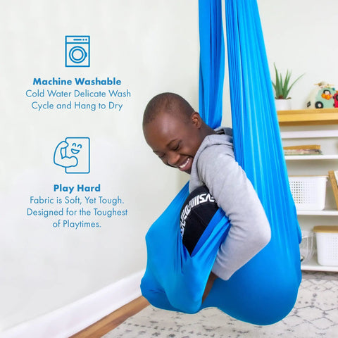 Child in blue sensory swing for kids and adults that feels like a big hug, indoor and outdoor safe, holds up to 300lbs, soft stretch nylon