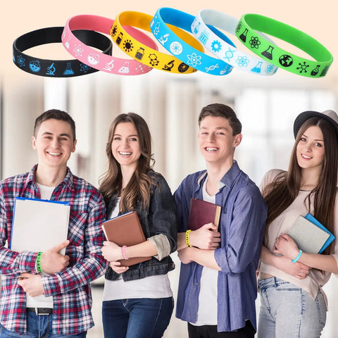 Students wearing Bulk 48 Piece Science Silicone Wristbands Set for Classroom Rewards and Teacher Gifts, colorful flexible rubber bracelets