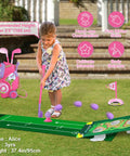 Toddler playing with Toddler Golf Set For Boys And Girls Ages 2 3 4 With Upgraded Kids Golf Cart, Putting Mat, And Cornhole Board, Durable Safe Design, Large 1.8 Inch Golf Balls, Outdoor Indoor Sports Toys Pink, demonstrating hand-eye coordination and fine motor skills on a lawn.