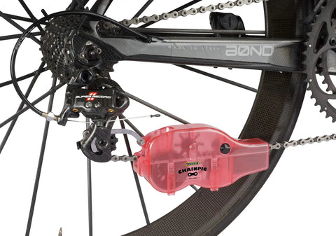 Chain Cleaning Tool II For Bike Chains Red Heavy Duty Plastic Chain Pig II With Bristle System Built To Last Chemical Resistant Design For Adults Long Lasting Performance Model PED218 on bike chain