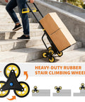 Person using Heavy Duty Stair Climbing Hand Truck With 440 Lbs Capacity Featuring Six Swivel Wheels Telescopic Handle on stairs.