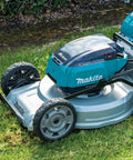 Pro Grade 21 Inch Cordless Self Propelled Lawn Mower in grass, featuring a brushless motor and aluminum deck.