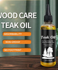 Premium 100ml Teak Oil For Wood Furniture And Hardwood Floor Restoration on a wooden table with labels about the product.