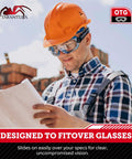 Worker wearing OTG Safety Goggles Over Glasses With Anti Fog And Anti Scratch UV380 Lenses reading blueprint outdoors.