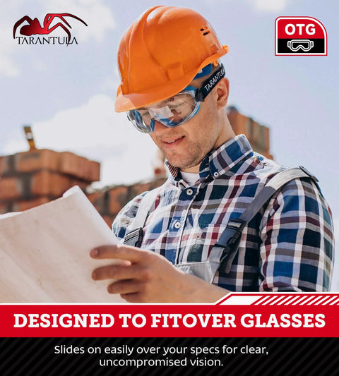 Worker wearing OTG Safety Goggles Over Glasses With Anti Fog And Anti Scratch UV380 Lenses reading blueprint outdoors.