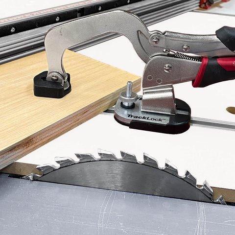 Universal T-Track Clamping System For Woodworking With Non Marring Base securing wood piece above a saw blade