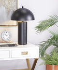 Black Metal Table Lamp With Dome Shade Modern Living Room Accent Light Durable Iron Construction on white desk.