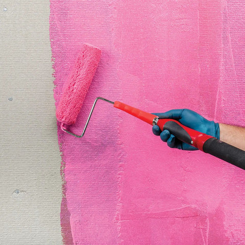 Applying liquid rubber waterproofing and crack isolation membrane with a roller for tile or stone floors and walls, one gallon size.