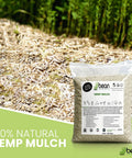Natural Hemp Garden Mulch Soil Conditioner For Moisture Retention And Weed Suppression Ideal For Flower And Vegetable Beds This Eco Friendly Potting Aid Keeps Soil Rich And Healthy Grown In The US 25 Lb Bag hemp mulch bag beside mulched garden bed