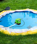 Automatic Pool Cover Pump Submersible 1200 GPH with four adapters and sixteen foot drain hose in operation on pool cover