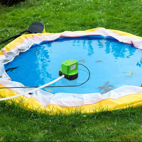 Automatic Pool Cover Pump Submersible 1200 GPH with four adapters and sixteen foot drain hose in operation on pool cover