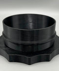 4-inch Port MagDuct dust-collector quick-disconnect fitting; black plastic cylindrical collar with star-shaped base.