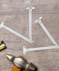Foldable Stainless Steel Lid Support Hinges 2 Pack Easy To Install with tools on wood surface