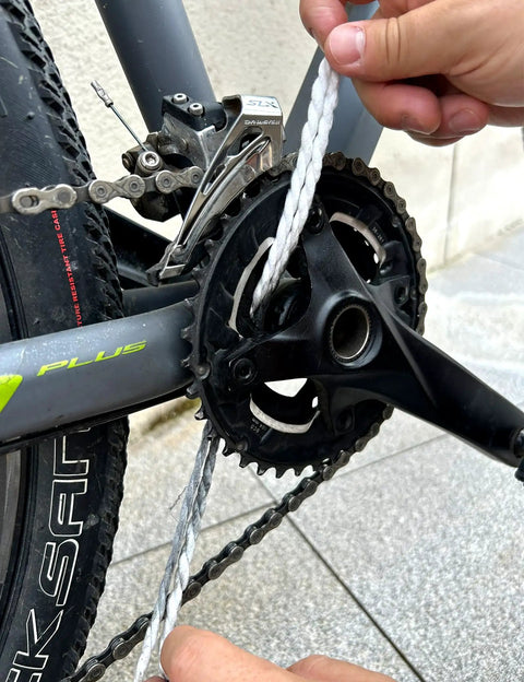Using Premium Microfiber Cleaning Rope Kit With Lubricating Cream 40 Pack on bike chain for precision maintenance.