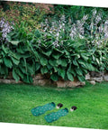 Durable Nylon Lawn Aerator Shoe Straps for manual aerator shoes on grass in a garden setting.