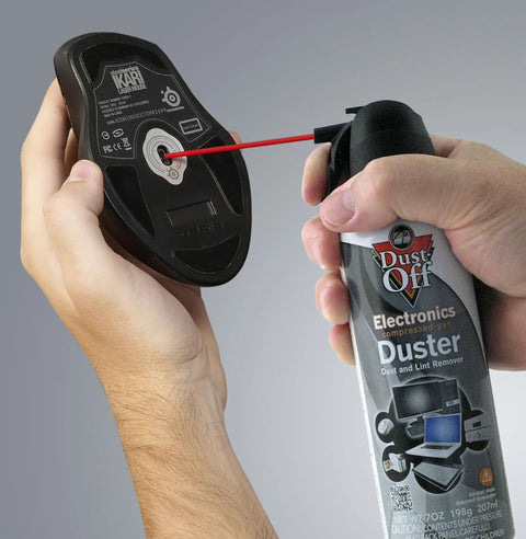 Dust Off Disposable Duster 7 Oz With Precision Straw used on computer mouse for quick dust removal, safe compressed air cleaning