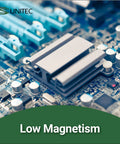 Close-up of a computer motherboard with a focus on a low magnetism component and connection slots.