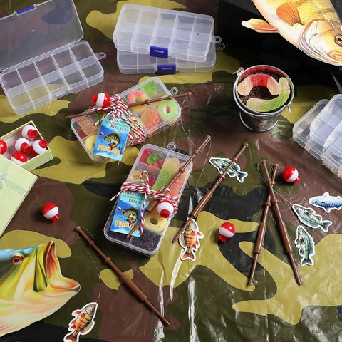 Gone Fishing Party Favors Kit with tackle boxes, mini fishing rods, red white floats, cards, and rope decor on a camo background.