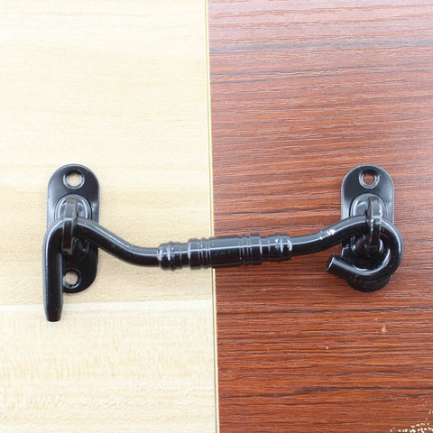 Two Pack Hook And Eye Latch Set Heavy Duty Stainless Steel Gate Latch Lock For Sliding Barn Doors Windows Shutters Garage Fence Closet And Shed Doors With Screws 4 Inch Black installed on a two-tone wood surface