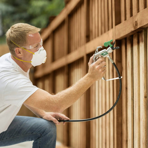 Man using Professional HEA Airless Paint Sprayer That Slashes Overspray And Delivers A Hella Smooth Finish On Walls Decks And Fences.