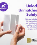 Hands holding a Locking Outlet Cover Box For Baby Proofing Enclosed Protector For Plugs And Cords Kid Safe Outlet Covers Easy Install Childproof Plug Box Preventing Access To Live Outlets Durable Home Safety Solution, showcasing BabySafe Pin Mechanism and Good Design Award logo.