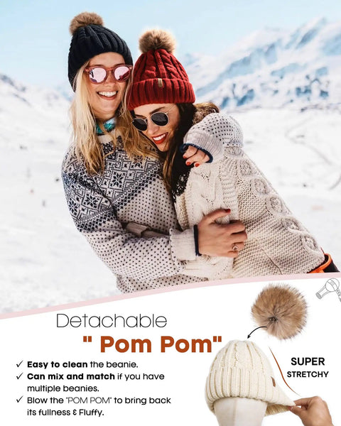 Women wearing Cozy Winter Beanie Knit Hat For Women Warm Fleece Lined With Faux Fur Pom Poms Thick Ski Skull Cap in snow.
