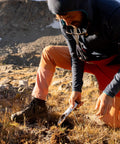 Hiker using Award Winning Ultra Lightweight Aluminum Backpacking Shovel For Camping And Hiking Ergonomic Trowel