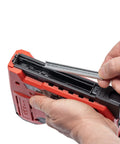 Corded Five In One Pro Grade Electric Staple And Nail Gun for Upholstery with staples being loaded, black and red.