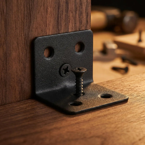 Close-up of 12 Pack Workhorse L Shaped Shelf Brackets 90 Degree Corner Supports with Screws installed on wooden surface