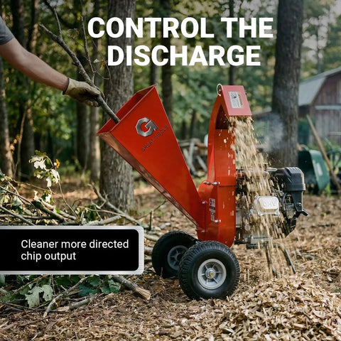 Ultra Duty 7 HP Gas Powered Wood Chipper Shredder Mulcher in action, chipping wood in a backyard cleanup setup.