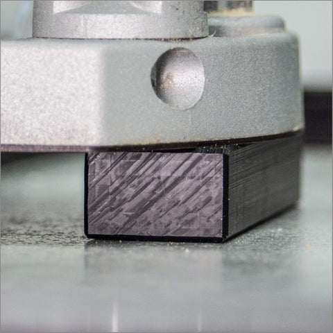 Close-up of Adjustable Router Jig Frame and Guide System for Cutting Square and Rectangular Recesses, Slots, and Face Panel Molds With a Router, Large 23.6 By 23.6 Inches Working Area, Four 27.6 Inch Extrusion Rails With Dual Metric Imperial Scales Varijig in use.