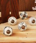 Vintage Style Off White Ceramic Cabinet Knobs And Handmade Drawer Pull Handles Featuring Glossy Antique Texture That Offer A Dang Nice Upgrade For Your Kitchen Counters, displaying five decorative knobs with intricate black designs.