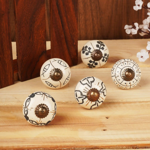 Vintage Style Off White Ceramic Cabinet Knobs And Handmade Drawer Pull Handles Featuring Glossy Antique Texture That Offer A Dang Nice Upgrade For Your Kitchen Counters, displaying five decorative knobs with intricate black designs.