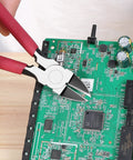 6 Inch Ultra Sharp Side Cutter Snips With Extra Long Flush Cutting Edge For Clean Flat Cuts used on a green circuit board