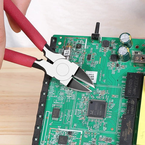 6 Inch Ultra Sharp Side Cutter Snips With Extra Long Flush Cutting Edge For Clean Flat Cuts used on a green circuit board