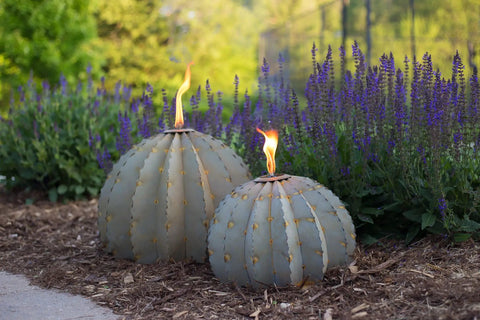 Golden Barrel Cactus Torch Outdoor Yard Art In Weatherproof Steel Large 18 Inch Wide By 13 Inch High Lawn Decor That Burns For 4 To 6 Hours Southwestern Desert Tiki Light For Backyard Vibes in a garden setting