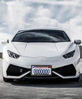 Front view of white sports car with Carbon Fiber Pattern License Plate Frames 2 Pack Black Aluminum Front And Rear Car Tag Holder